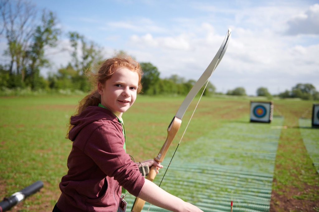 Drew archery at Anthony Nolan family camp