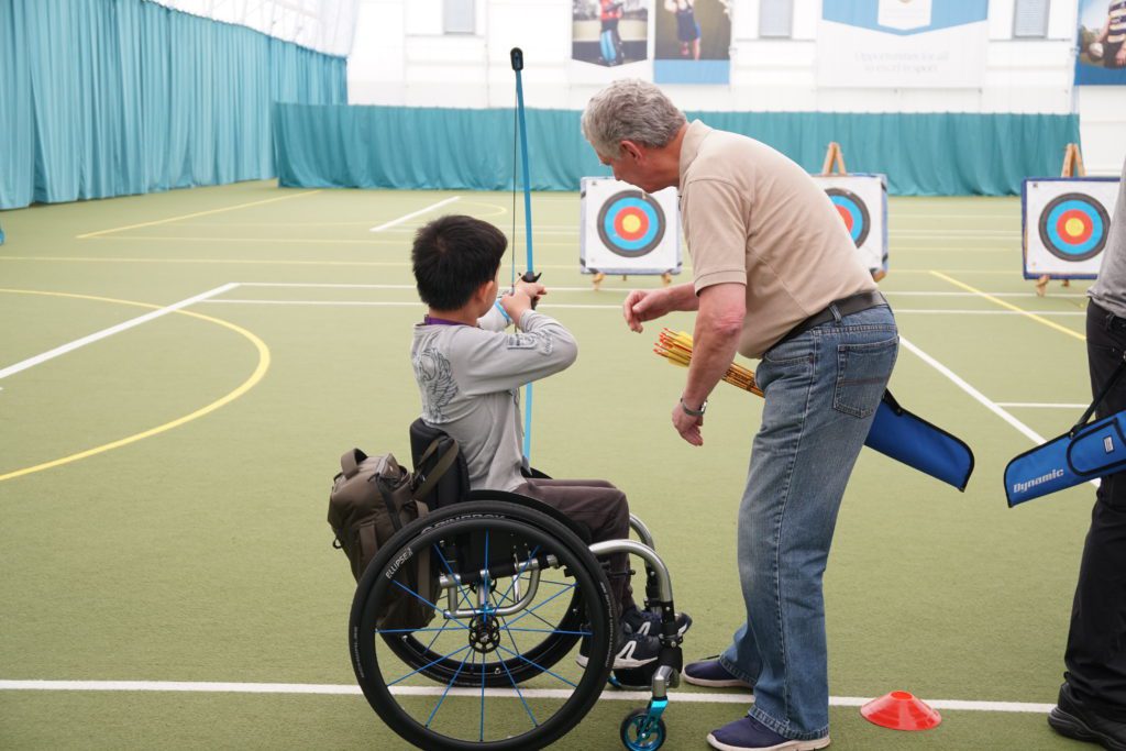 learning archery at camp